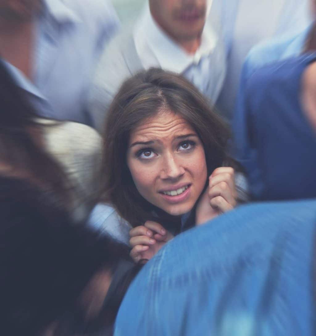 girl-trapped-in-crowd Learn about the Signs and Symptoms and Treatment Options for Social Anxiety Disorder.